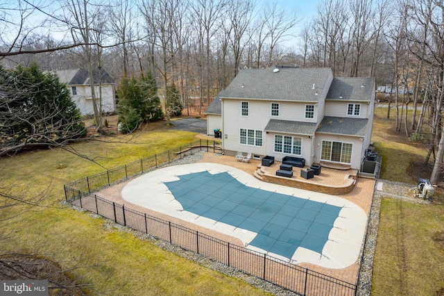 view of swimming pool with a fenced in pool, a patio, a lawn, entry steps, and a fenced backyard