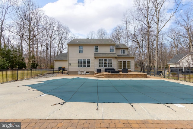 view of pool featuring a patio area, fence, and a fenced in pool