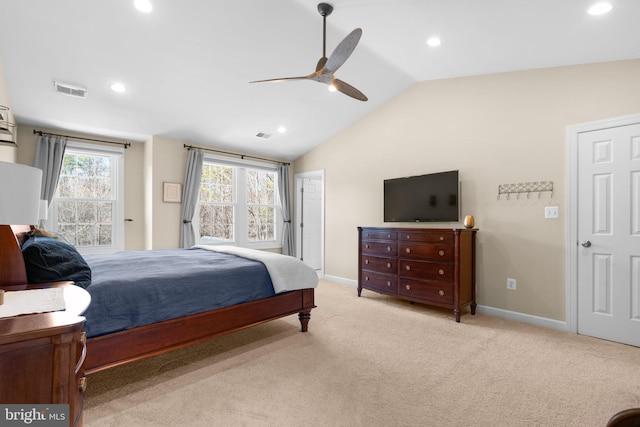 bedroom featuring visible vents, lofted ceiling, light colored carpet, and baseboards