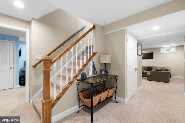 stairway with recessed lighting, baseboards, and carpet