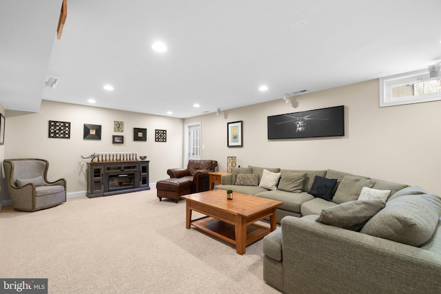 living room with visible vents, baseboards, carpet flooring, recessed lighting, and a fireplace