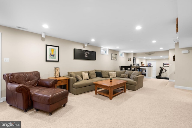 living room featuring recessed lighting, visible vents, light carpet, and baseboards