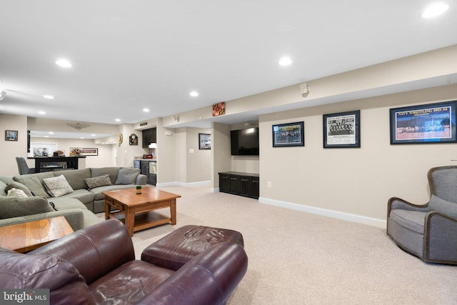 living room with recessed lighting, light colored carpet, indoor bar, and baseboards