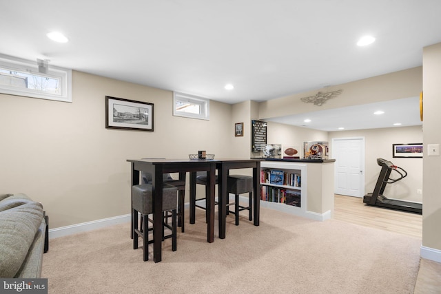 dining space featuring carpet flooring, recessed lighting, and baseboards