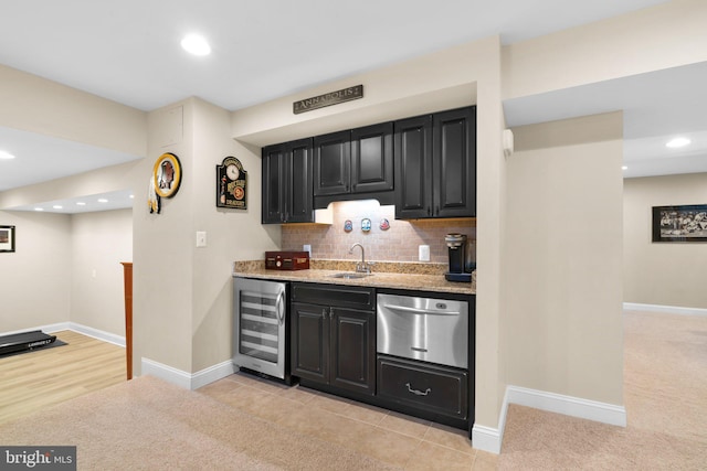 bar with baseboards, wine cooler, and tasteful backsplash