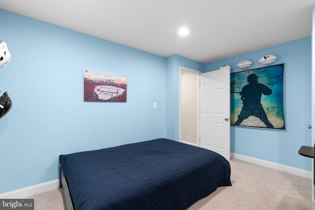 carpeted bedroom with baseboards