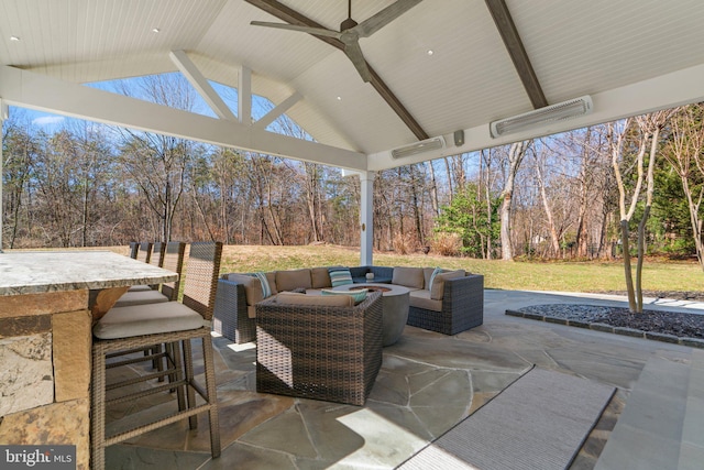 view of patio with outdoor dry bar and an outdoor living space