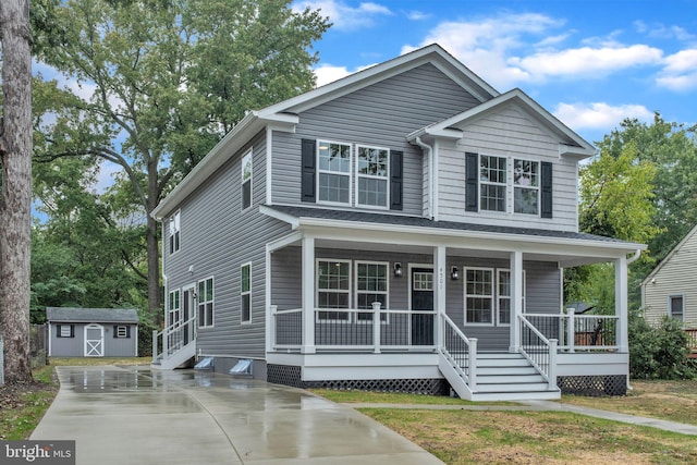 traditional-style home with a storage shed, a porch, and an outdoor structure