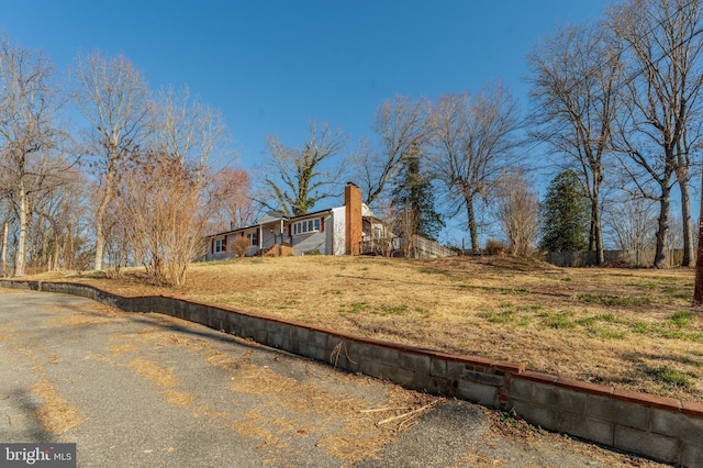 view of front of house featuring a chimney