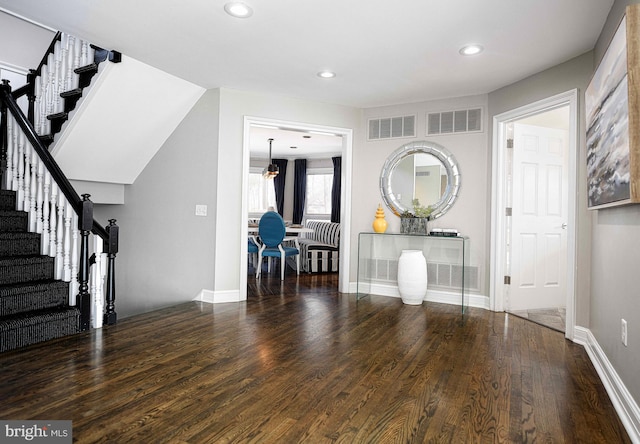 interior space featuring visible vents, recessed lighting, stairway, and wood finished floors