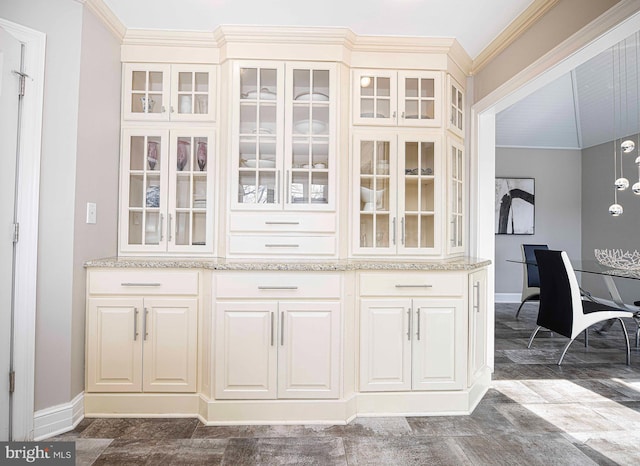 bar featuring baseboards and crown molding