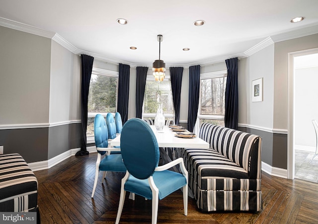 dining room with plenty of natural light, baseboards, and ornamental molding