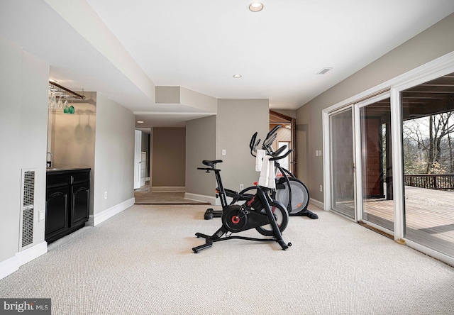 exercise room featuring visible vents, recessed lighting, carpet, and baseboards