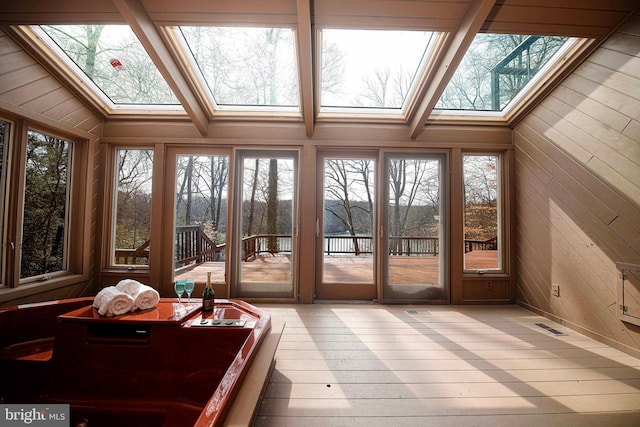 sunroom / solarium featuring a skylight and visible vents