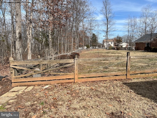 view of gate with fence