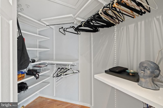 spacious closet with wood finished floors