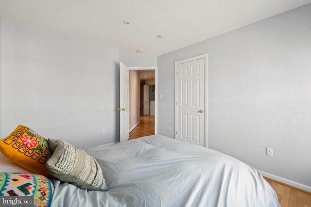 bedroom with wood finished floors