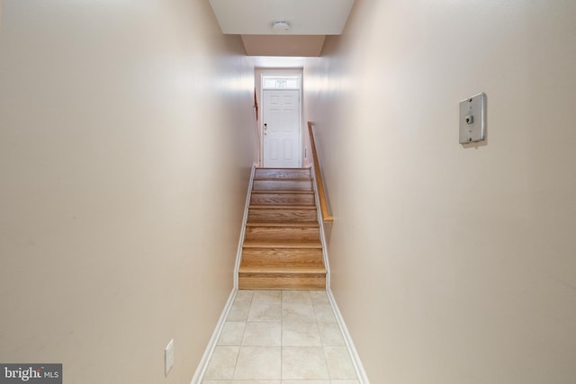 interior space featuring tile patterned floors and baseboards