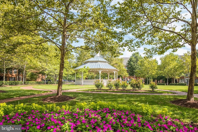 view of community with a lawn and a gazebo