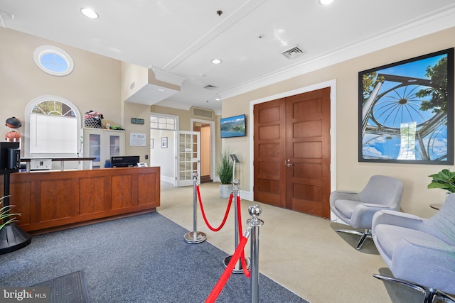 office featuring recessed lighting, light colored carpet, visible vents, french doors, and ornamental molding