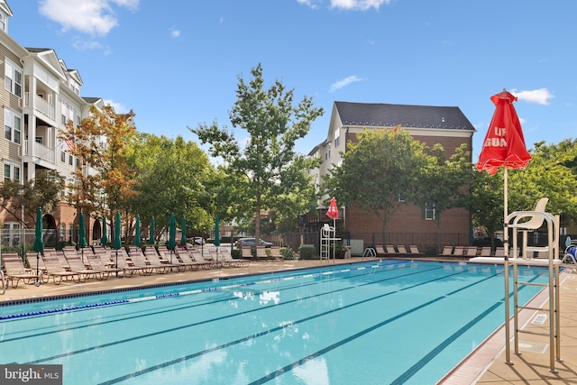 pool featuring fence and a patio