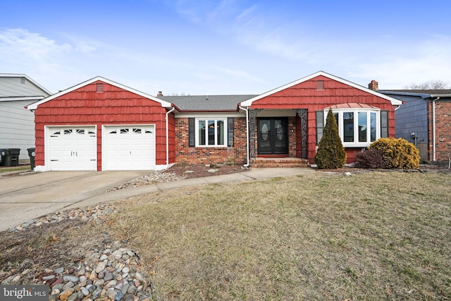 ranch-style home featuring brick siding, a chimney, a garage, driveway, and a front lawn