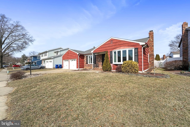 view of front of home with a garage, fence, concrete driveway, a chimney, and a front yard