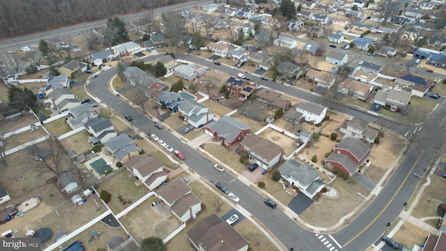 birds eye view of property with a residential view