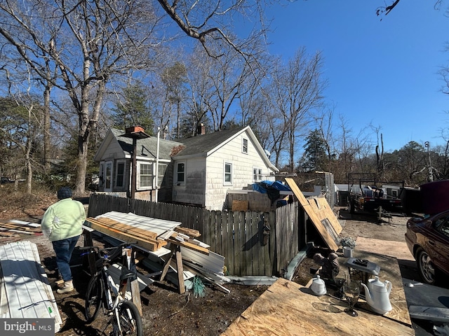 view of side of home with fence