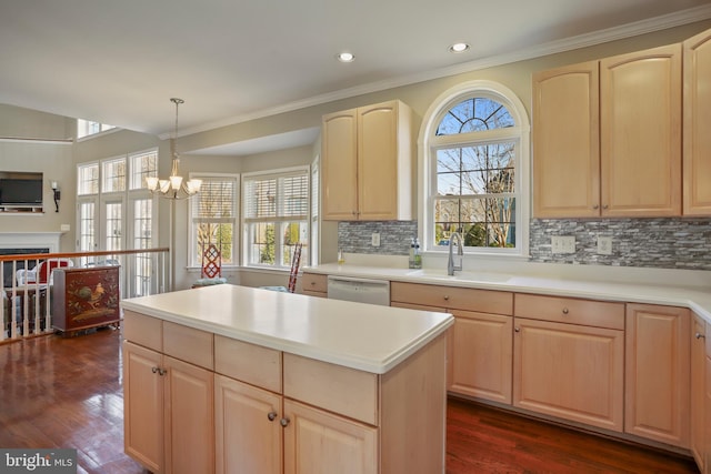 kitchen with decorative backsplash, light brown cabinetry, dark wood-type flooring, a sink, and dishwasher