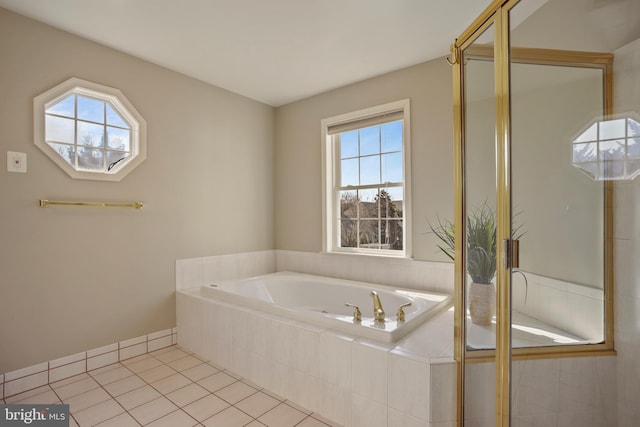 full bath featuring a stall shower, tile patterned flooring, a bath, and a healthy amount of sunlight