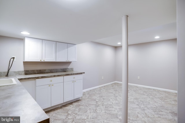 interior space featuring recessed lighting and baseboards