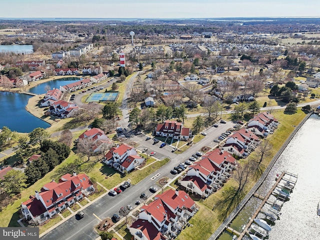 birds eye view of property featuring a water view and a residential view