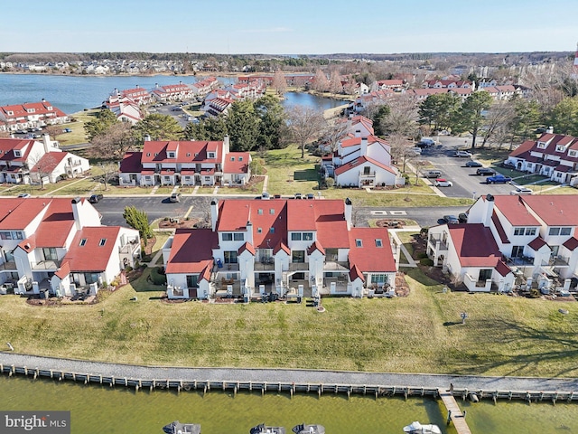 birds eye view of property featuring a residential view and a water view