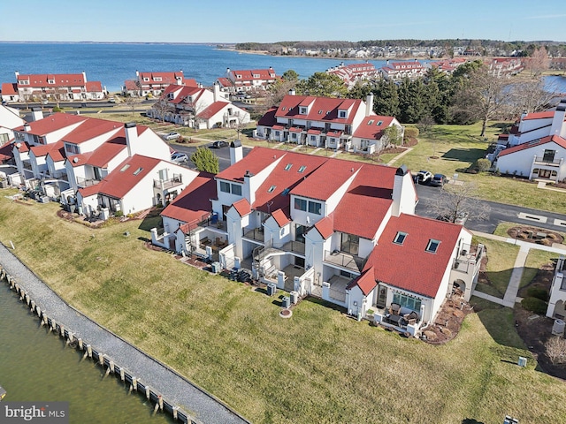 bird's eye view featuring a residential view and a water view