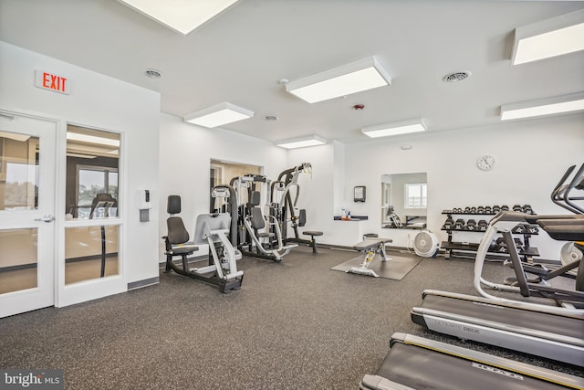 gym with visible vents and baseboards