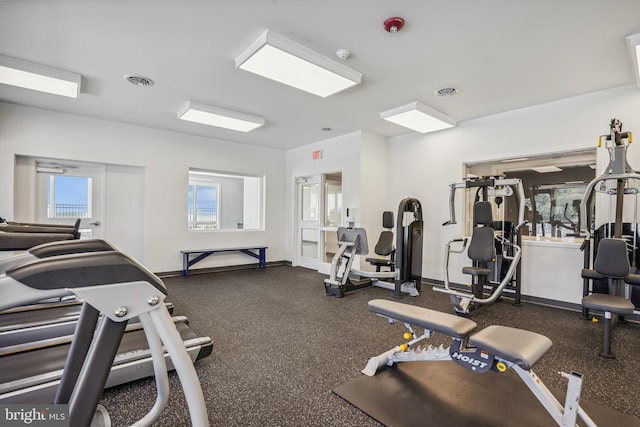 workout area with visible vents and baseboards