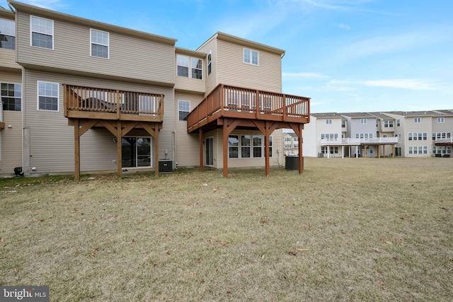 back of property with cooling unit and a yard