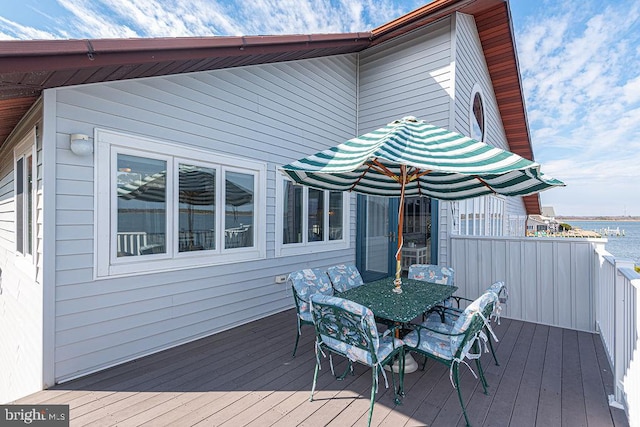 wooden deck with outdoor dining space