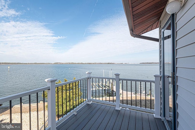 wooden deck featuring a water view