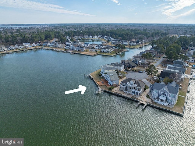 drone / aerial view featuring a water view and a residential view