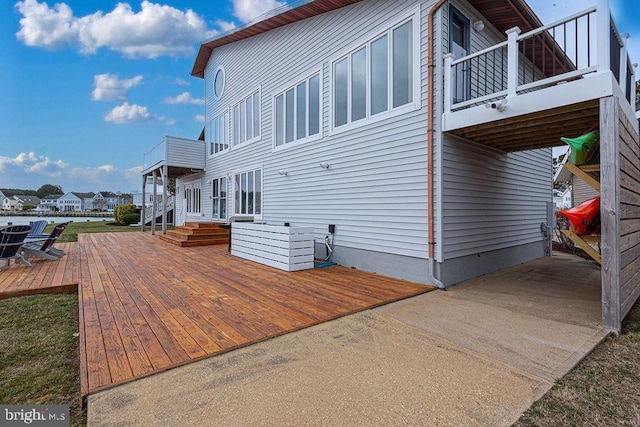 view of side of property featuring a deck