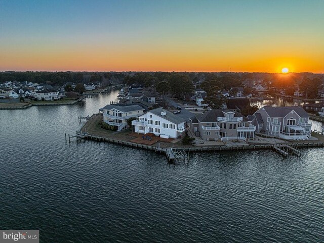 drone / aerial view with a residential view and a water view