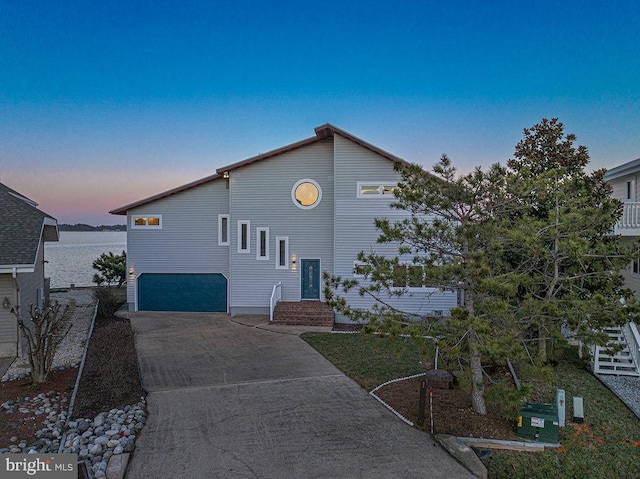 view of front facade featuring a garage and concrete driveway