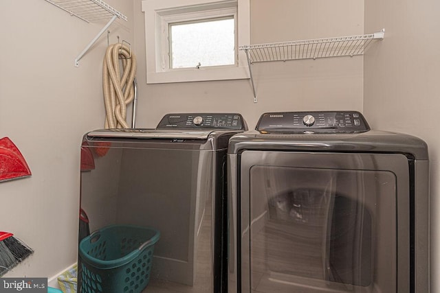 laundry room featuring laundry area and washing machine and clothes dryer