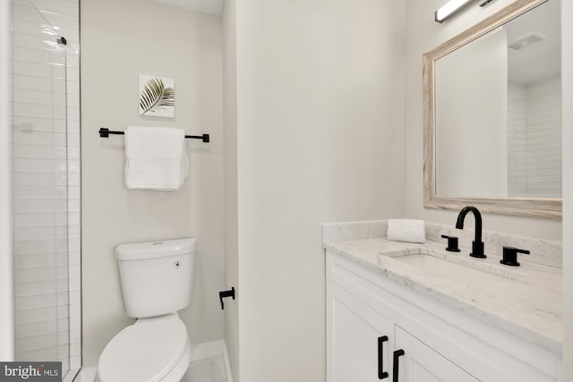 full bath featuring visible vents, vanity, toilet, and baseboards