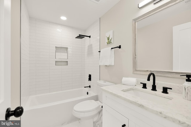 bathroom featuring toilet, recessed lighting, vanity, marble finish floor, and washtub / shower combination