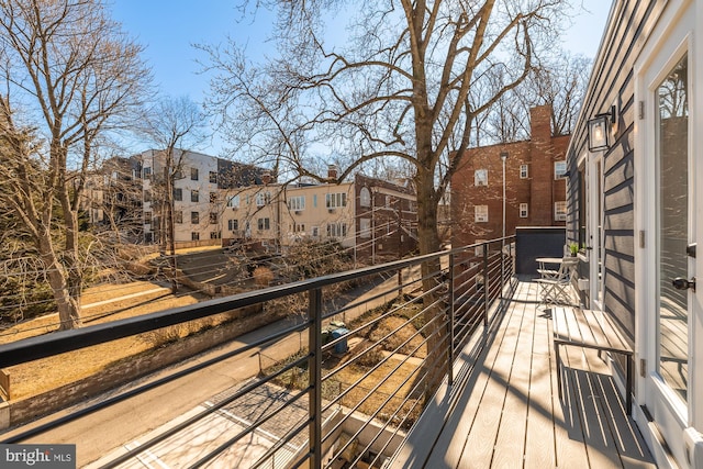 wooden terrace with a residential view