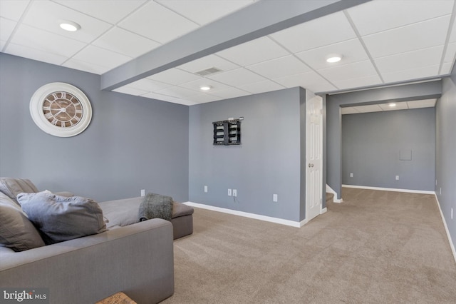 living room featuring carpet flooring, baseboards, visible vents, and a paneled ceiling