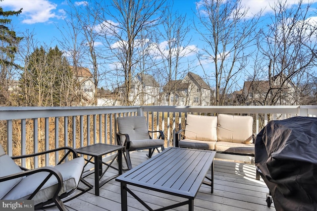 wooden terrace featuring grilling area and outdoor lounge area